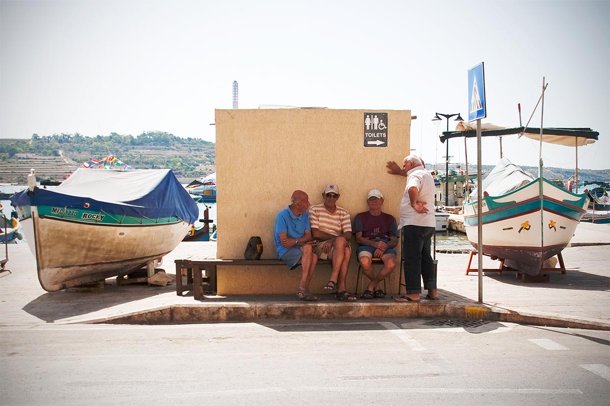 Marsaxlokk old people discussing malta sea mare vacanze holiday island isola